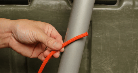 Shows the wrapping of the rope around an object to form a round turn.