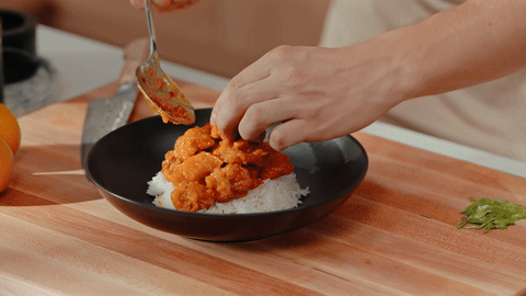 Shows the final plating of the dish with garnishes.