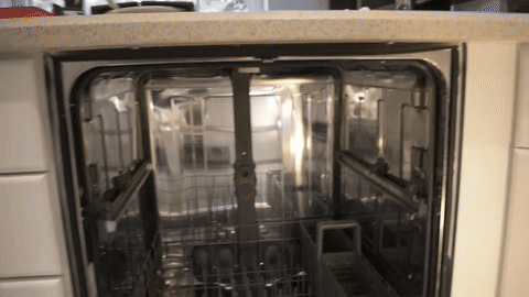 Shows the process of loosening brackets and removing the old dishwasher.