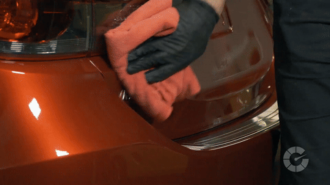 Shows the removal of cured sealant with a microfiber towel.