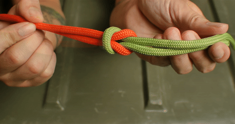 Shows the completion of the square knot, resulting in a symmetrical appearance.
