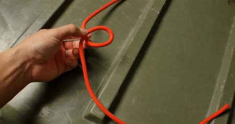 Illustrates the steps to complete the bowline, forming a secure loop.