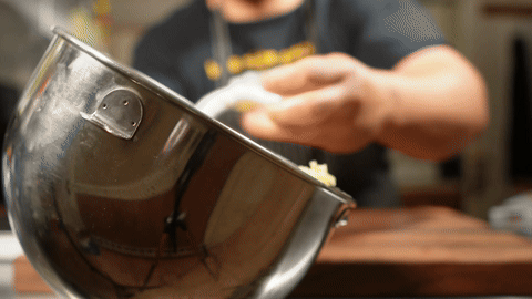 Illustrates placing the dough in a bowl, covering it, and setting it aside to rise.
