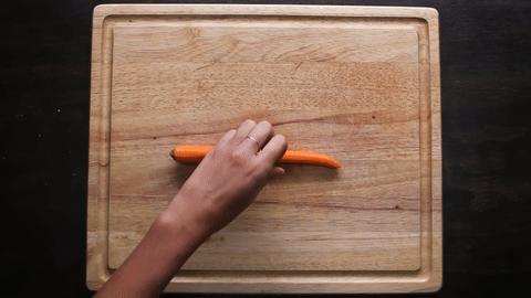 Shows trimming the carrot end diagonally.
