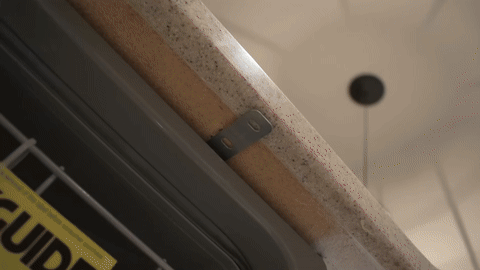 Shows the final steps of checking for leaks and turning the water supply back on.