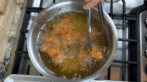 Shows the final presentation of the crispy wings.