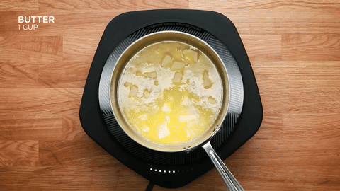 Butter boiling in a saucepan and turning brown.