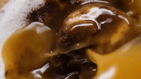 Adding brown butter to sugar mixture and creaming them together.