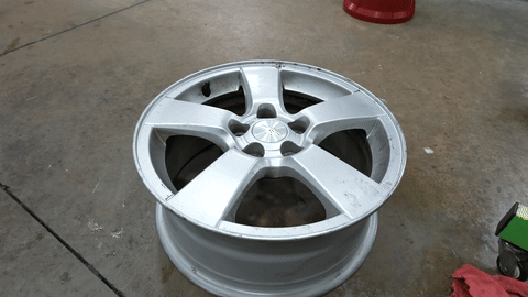 Shows the process of using tire spoons to remove the tire.