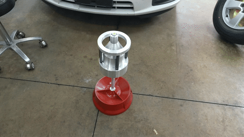 Shows the use of a bubble balancer to balance the tire.