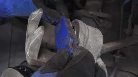 Shows the use of a piston compressor to push the piston back.