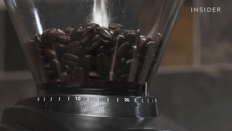Shows the grinding of coffee beans to the correct consistency.
