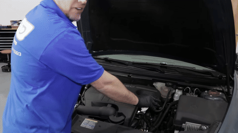 Close-up of the engine bay showing the engine position and oil fill cap.