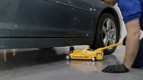 Demonstration of properly raising the vehicle with a jack and jack stands.