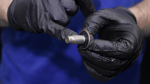 Inspection of the drain plug and gasket, followed by secure reinstallation.