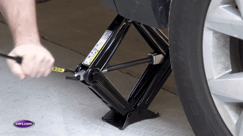 Car being jacked up safely.