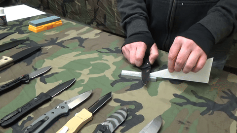 Knife sharpening technique with even passes on the stone.