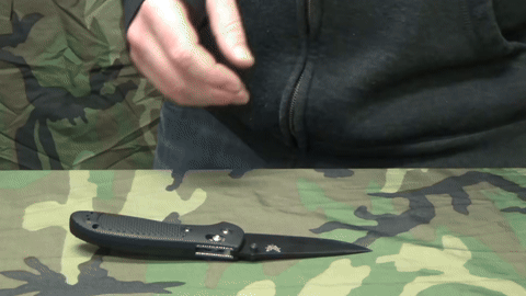 Polishing the knife with leather on a stable surface.
