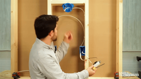 Connecting the black wire to the common terminal in switch two.