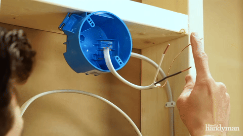 Connecting wires at the light fixture.