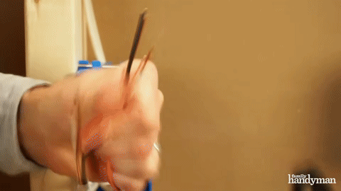 Shows the process of stripping wires.