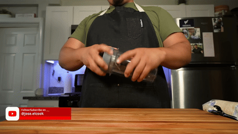 Adding Roma tomatoes to the blender.