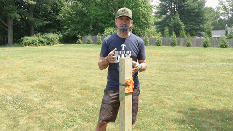 Demonstrates final adjustments to the post's level and the waiting period for the concrete to set.
