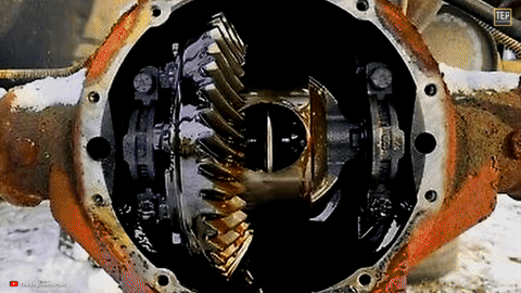 Shows the differential being refilled and cover secured.