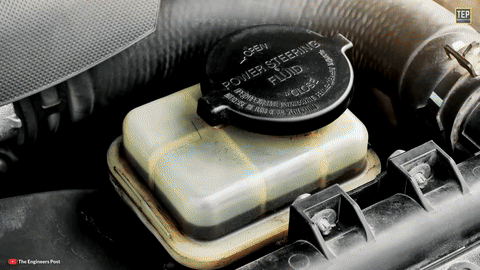 Shows the power steering reservoir location.